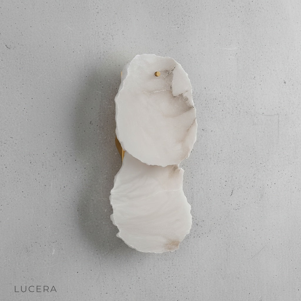 Esker wall lamp side profile showing sculptural alabaster and polished copper