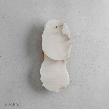 Esker wall lamp side profile showing sculptural alabaster and polished copper