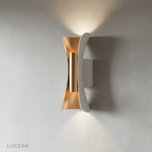 sleek aluminum and acrylic wall lamp mounted on a neutral studio wall