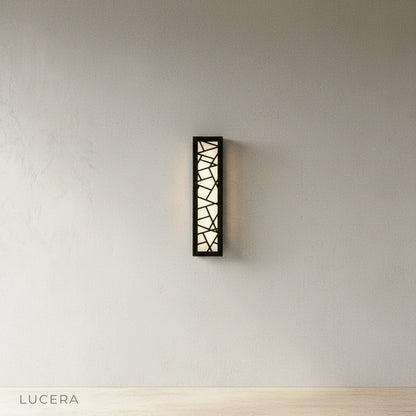 sleek black aluminum Emblem Wall Lamp with integrated LED glowing softly