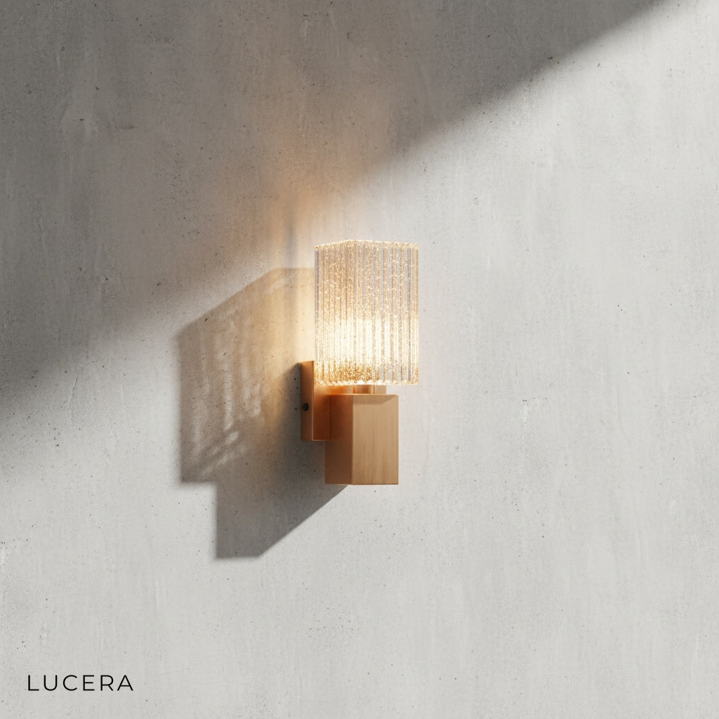Slargando LED wall sconce lit softly against neutral wall, modern luxury bedroom ambiance