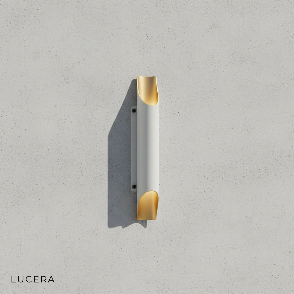 Close-up of Crema LED wall lamp white gold variant highlighting brushed metal texture and warm light