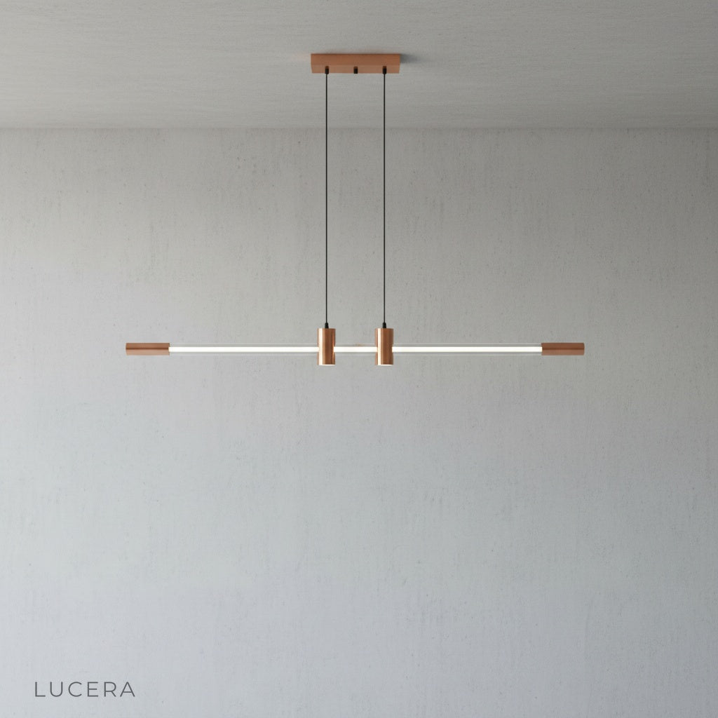 Studio view of Gideon pendant light showing adjustable chain and sleek metal canopy