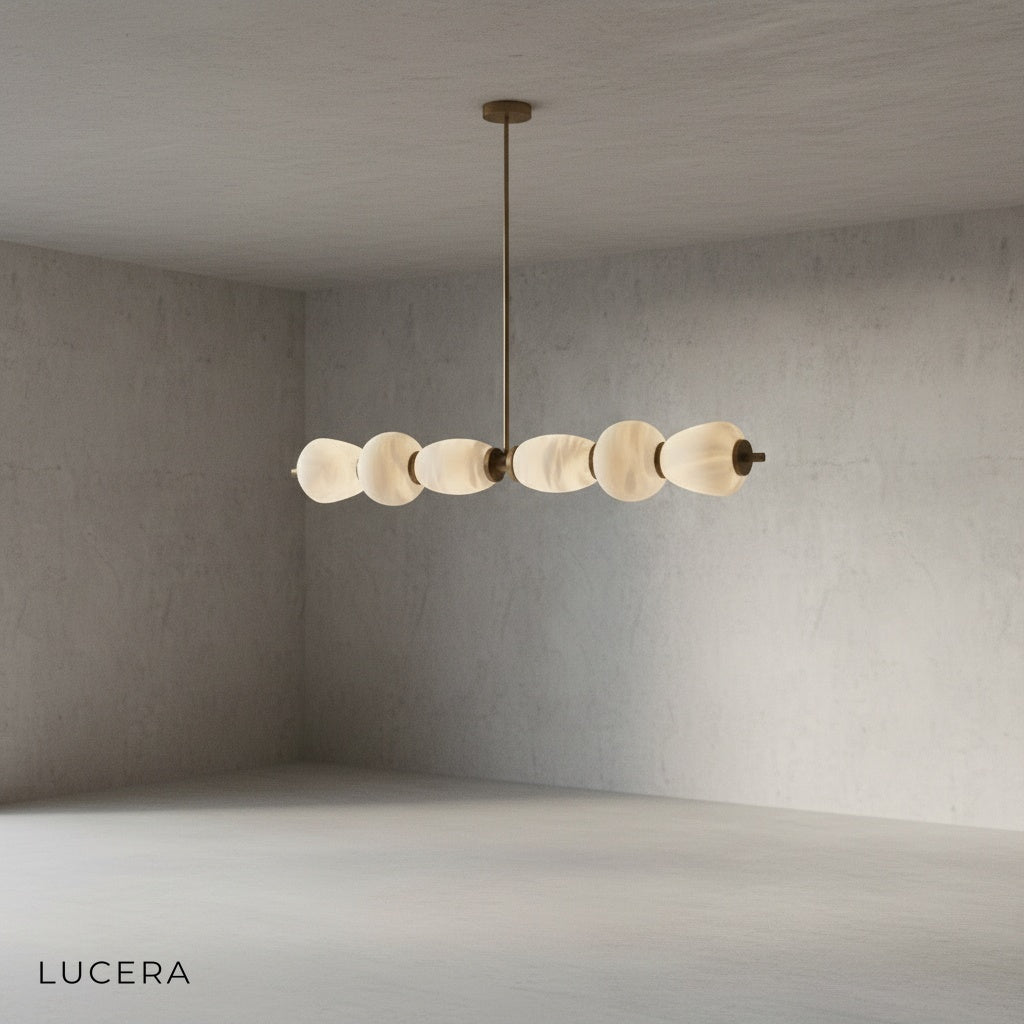 close-up of natural marble veining and brushed copper hardware on linear chandelier