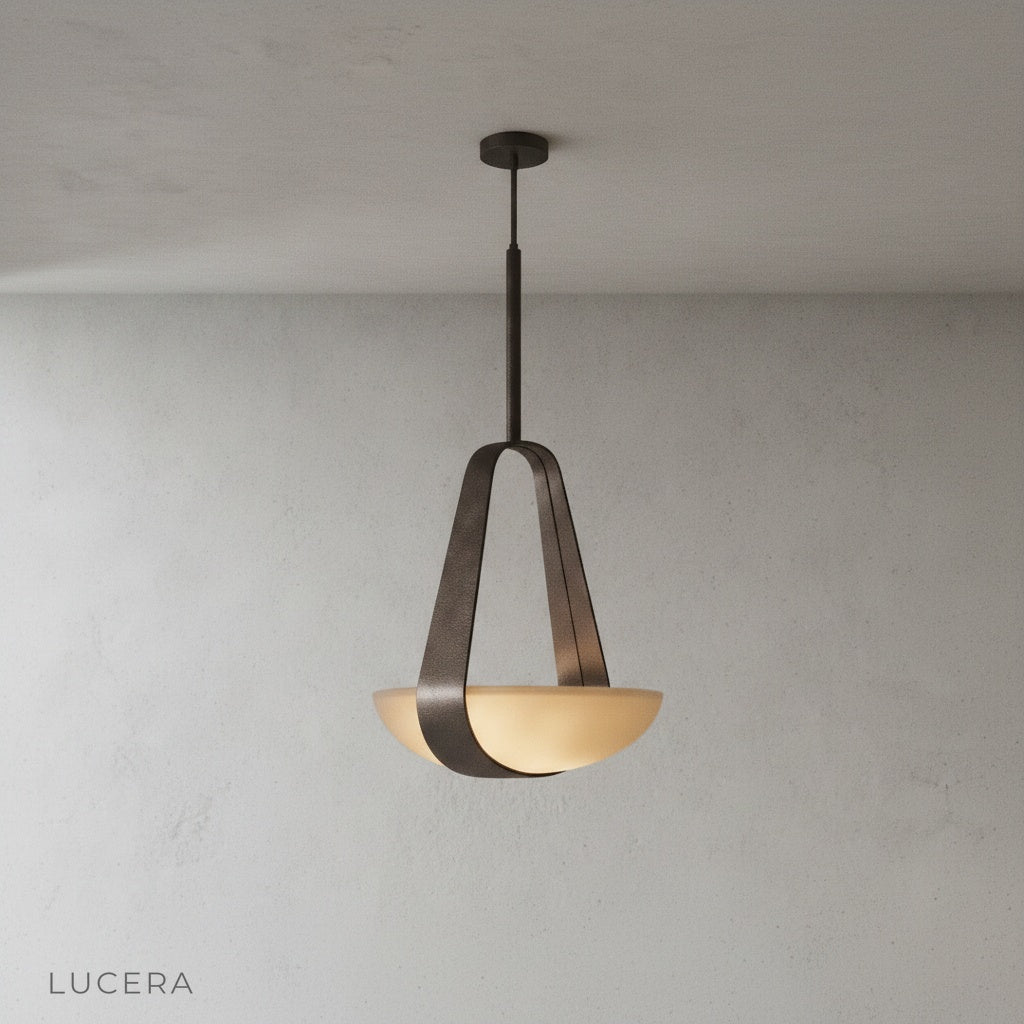 Talus pendant light front view on clean white background showing leather and glass details