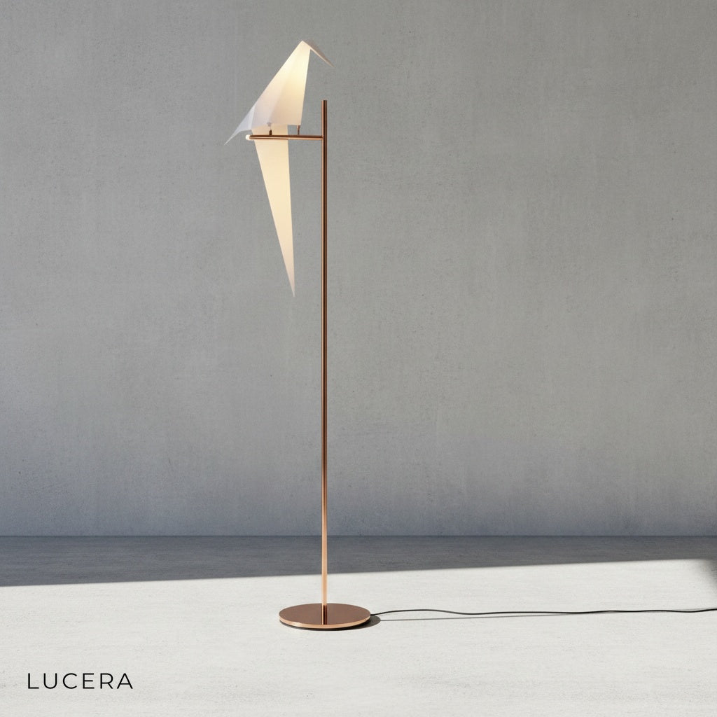 close-up of parrot-shaped lamp head showing lustrous gold finish and fine craftsmanship