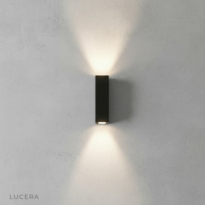 gold wall lamp front view on clean white background showing brushed finish