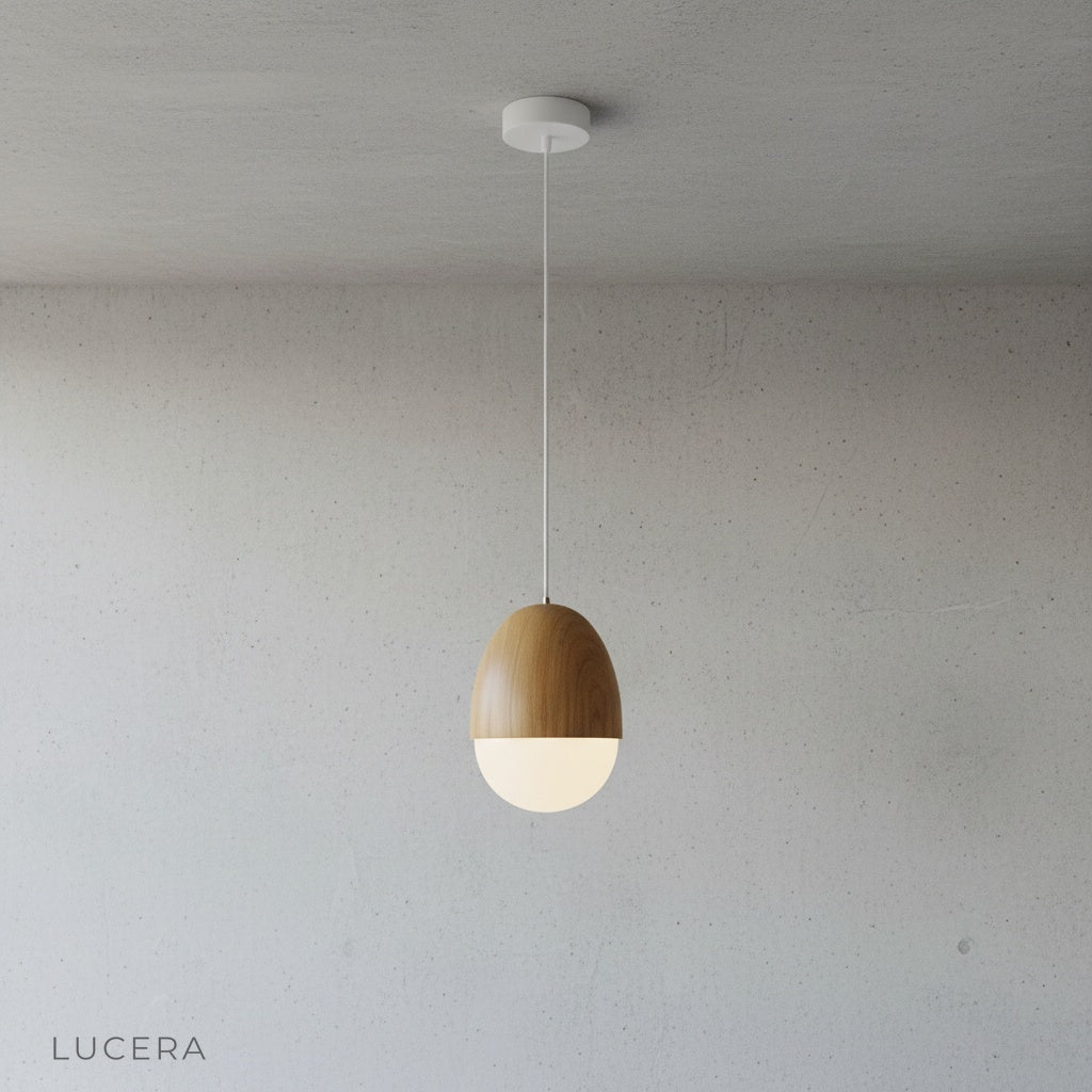 minimalist wood-look pendant light hanging centered in bright studio setting front view