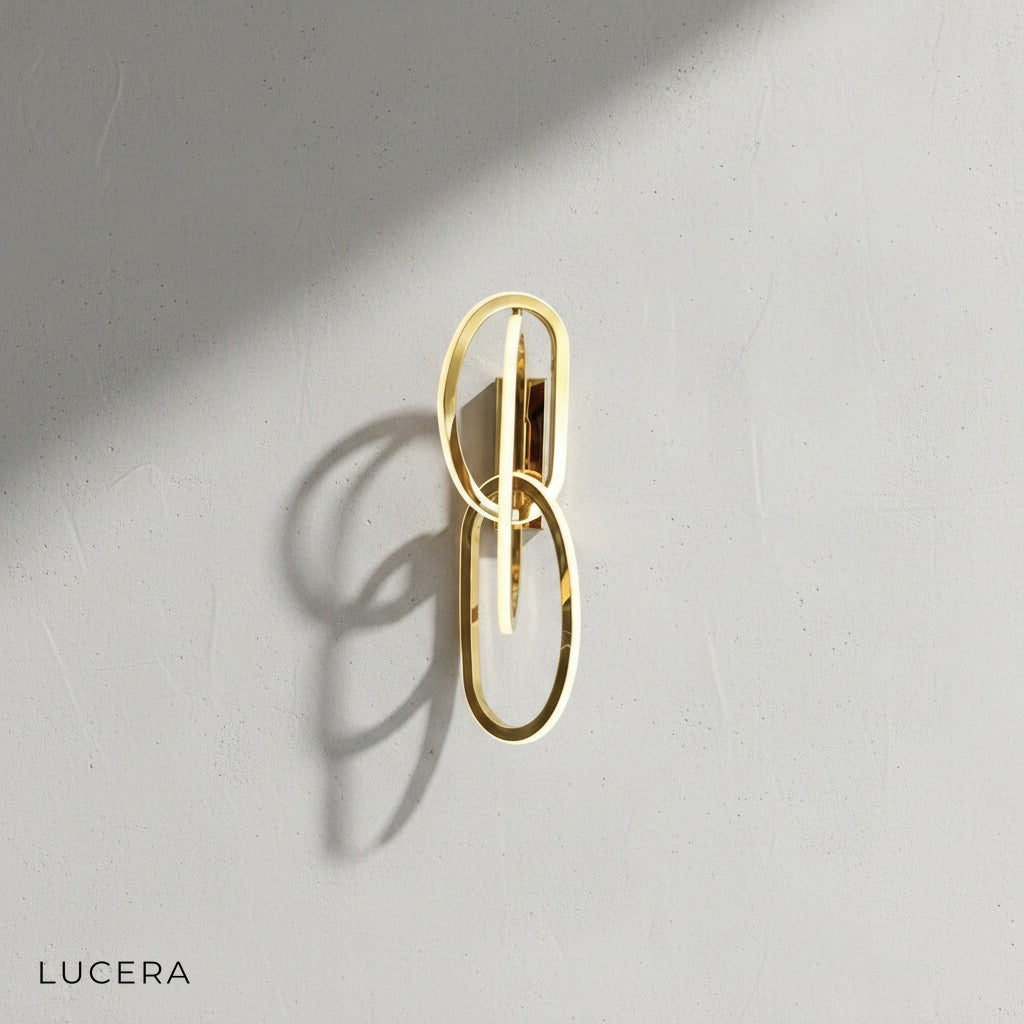 close-up detail of acrylic shade and brushed steel arm on luxury wall lamp