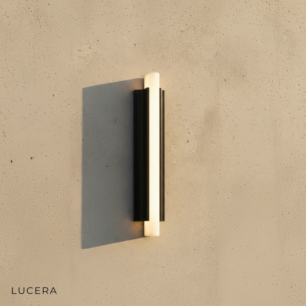 close-up of Corvus wall light textured sand black finish and diffused LED panel