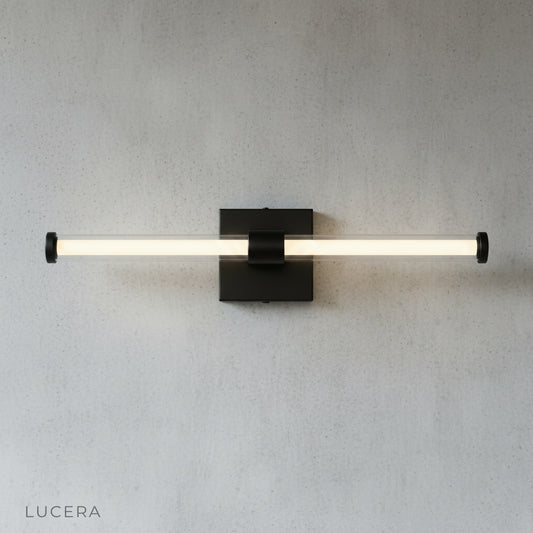 minimalist black glass wall sconce mounted on white wall studio product photography