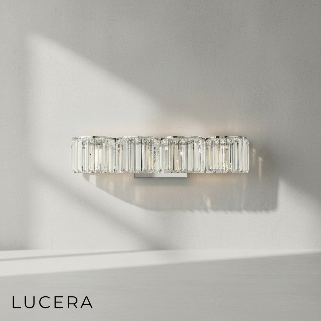 Close-up of gold Vibrato sconce showing intricate crystal prisms and robust metal arm