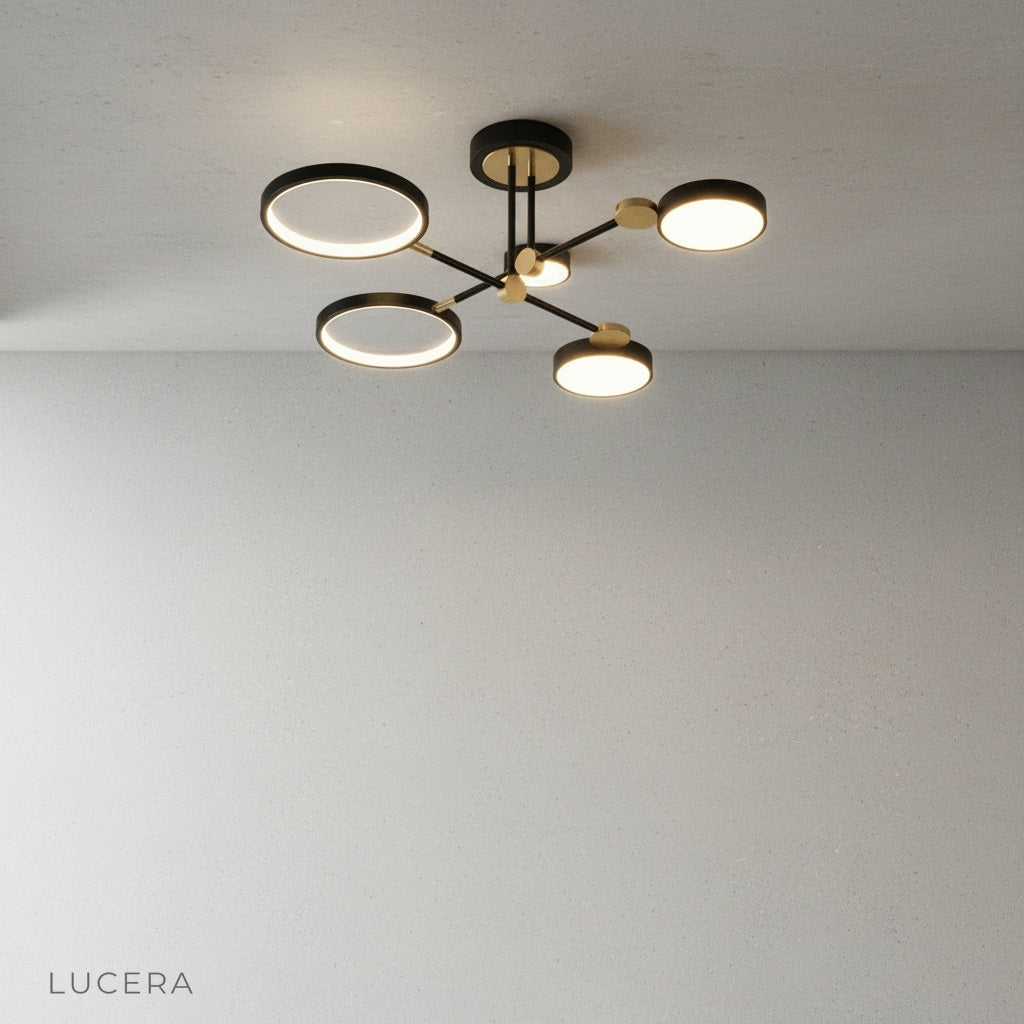 Minimalist studio view of black and gold yin-yang ceiling light against clean white background