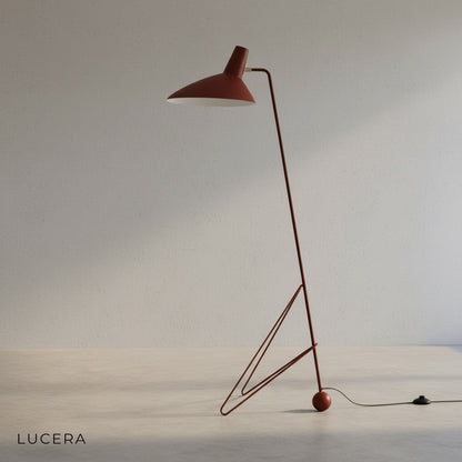 close-up of matte iron tripod base and slender frame of floor lamp