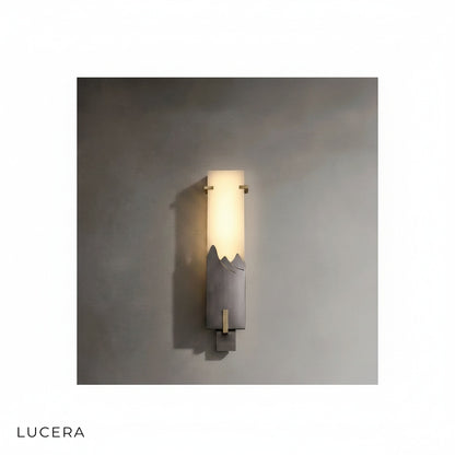 Pair of Axonal antique marble wall lamps flanking a vintage mirror in hallway