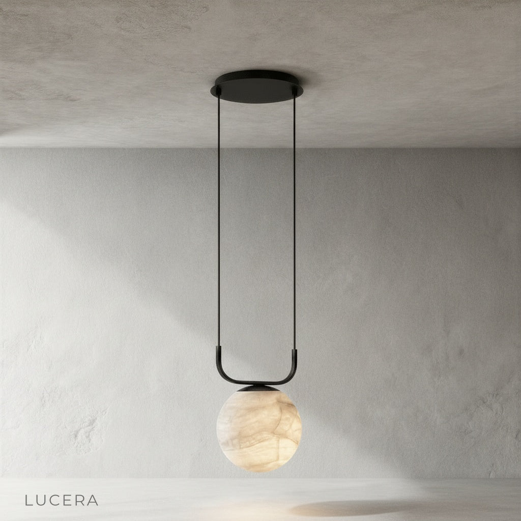 Alabaster and aluminum Bibelot pendant lamp hanging from ceiling front view