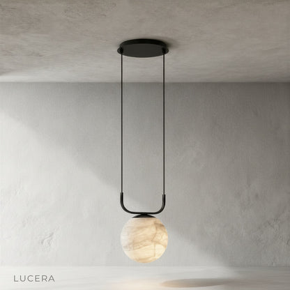 Alabaster and aluminum Bibelot pendant lamp hanging from ceiling front view