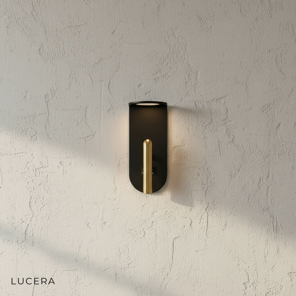 modern wall sconce with warm glow mounted on dark wall in contemporary living space