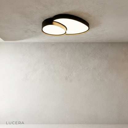 Yielding ceiling light front view on clean white background showing abstract circular form