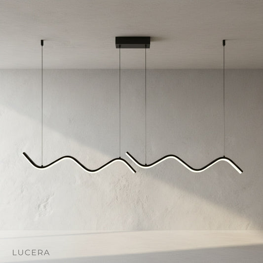 studio shot of sculptural aluminum and iron Melisande pendant light on clean background