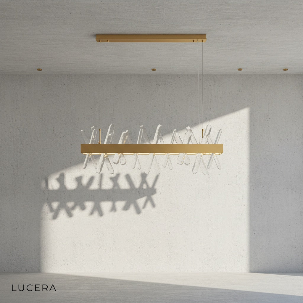 detail view of crystal prisms reflecting warm light on Arte chandelier
