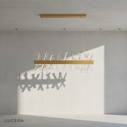 detail view of crystal prisms reflecting warm light on Arte chandelier