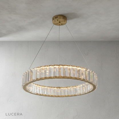 front view of Lucera Carmelite chandelier showing adjustable wire and brass finish