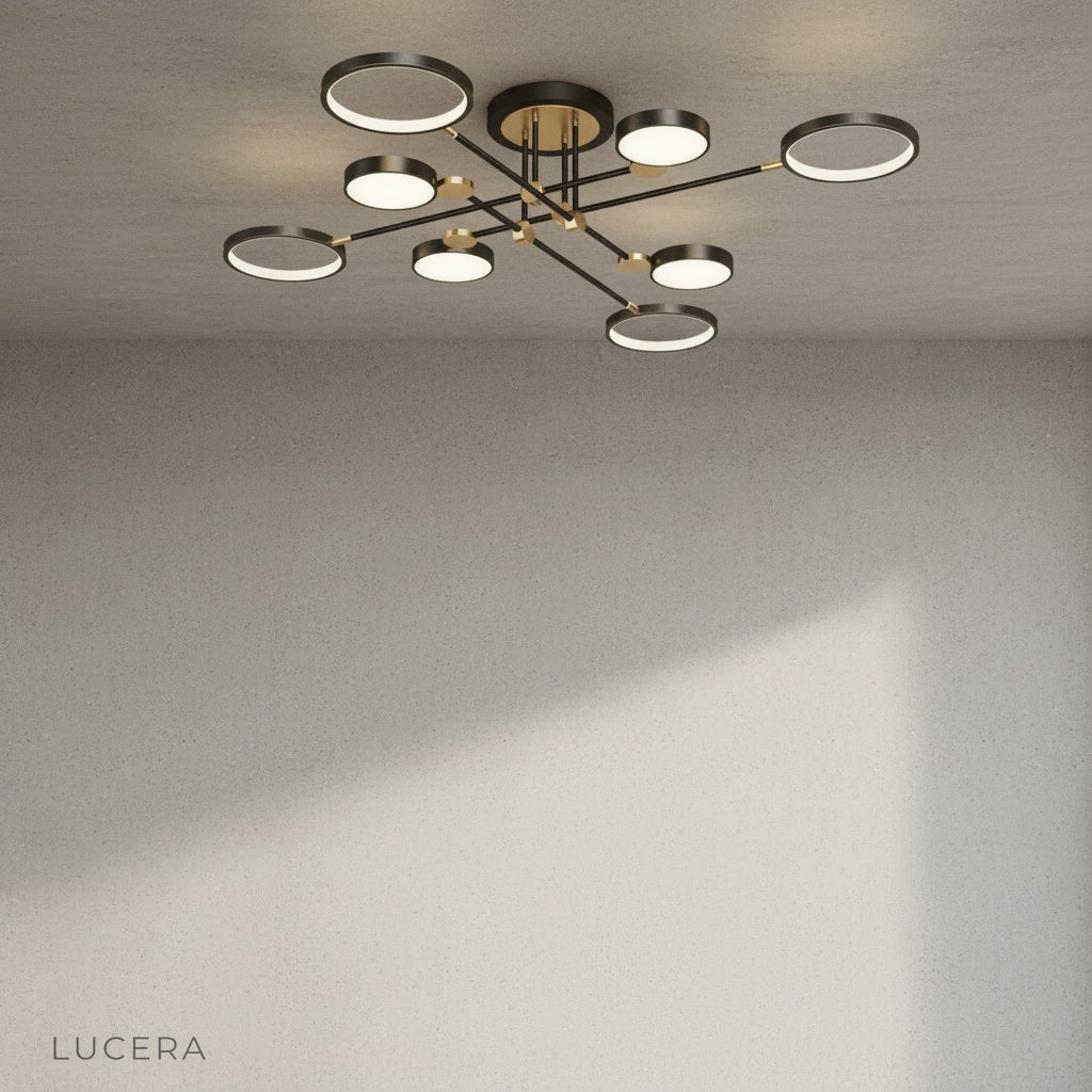Yin-yang ceiling light above bedside tables in elegant hotel-style bedroom with gold details
