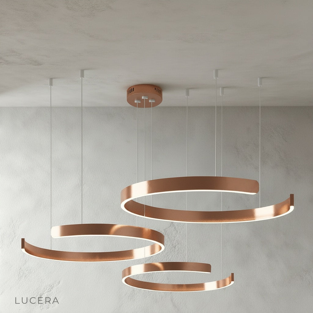 Bedeck chandelier at low height above glass table in sunlit conservatory
