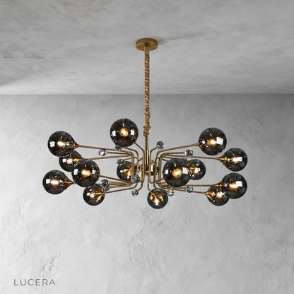 Ellipse chandelier suspended over a wooden table in a rustic-chic cafe