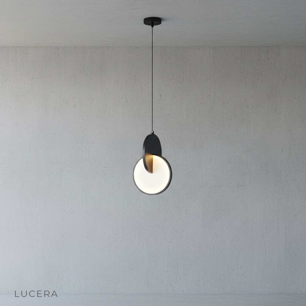 overlapping circle pendant light in open plan living room with neutral sofa and plants