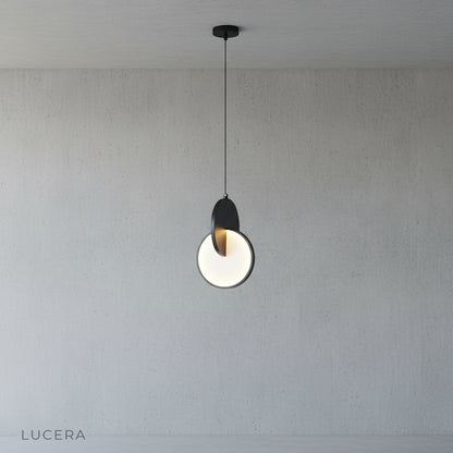 overlapping circle pendant light in open plan living room with neutral sofa and plants