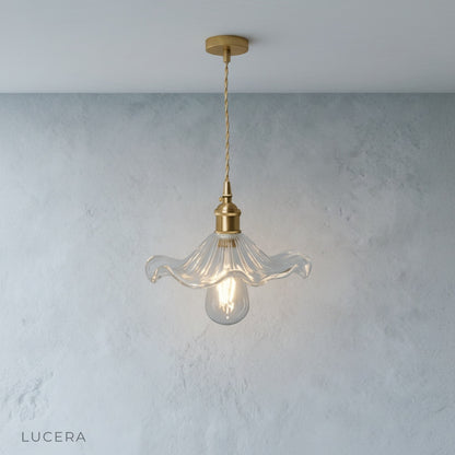 studio back view of Lucera pendant light showing brass canopy and adjustable wire