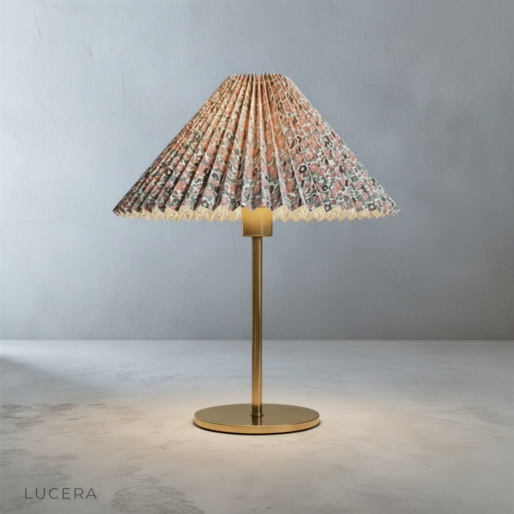 Ysabel Table Lamp with brass base on a marble countertop in a chic bathroom setting