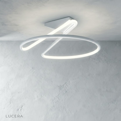 Loom ceiling light with warm filament glow in industrial loft