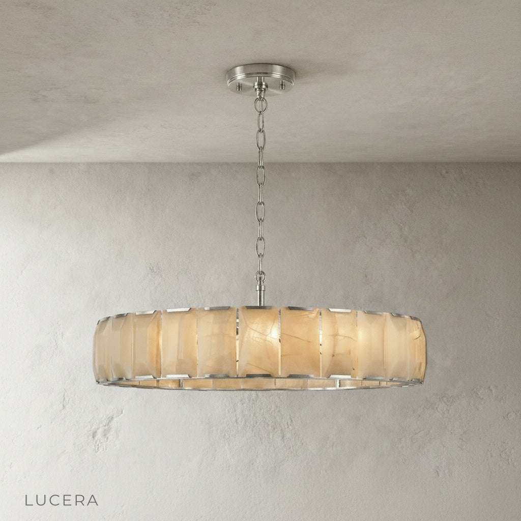 Vivid Round Alabaster Chandelier in a stairwell with tall ceilings and natural stone accents
