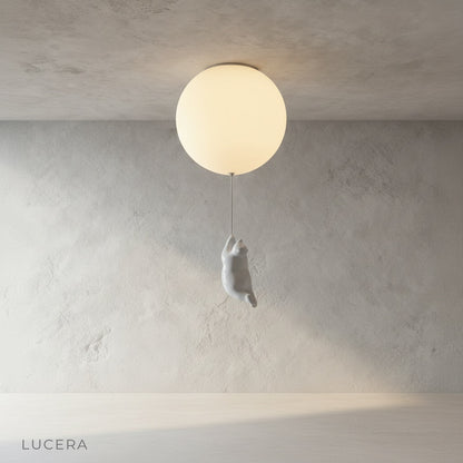 Lintel bear lamp glowing in dim nursery with starry wall decals