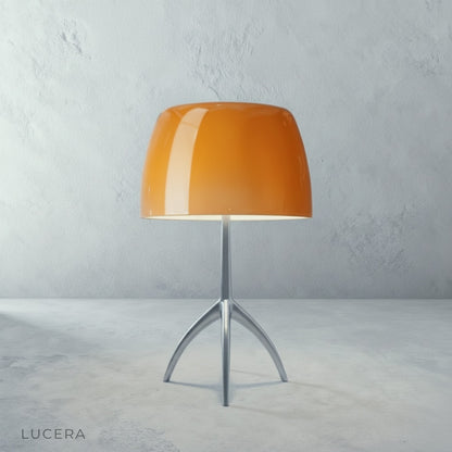 Albescent Table Lamp in soft white on a window sill with sheer curtains and golden hour light
