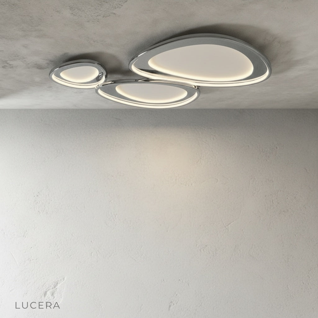 Tantalus ceiling light nighttime shot with elegant shadows and bright diffuser