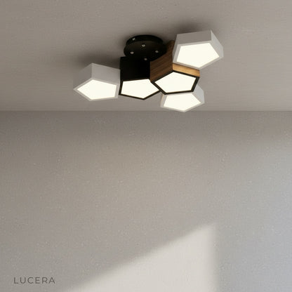 Zelator ceiling light as statement piece in elegant lounge with layered lighting effects