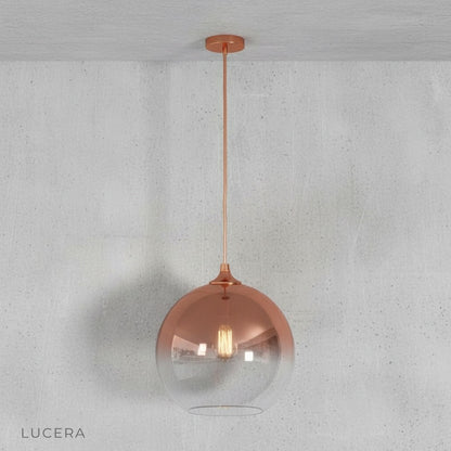 Aesthetic lifestyle shot of green gold pendant light in a bright Scandinavian-style interior