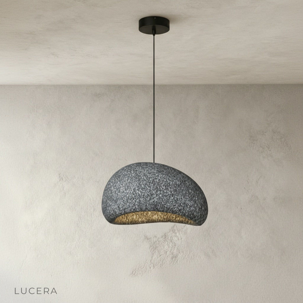 close-up of rounded wabi-sabi pendant shade showing sandy matte texture