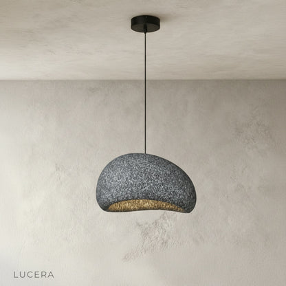 close-up of rounded wabi-sabi pendant shade showing sandy matte texture
