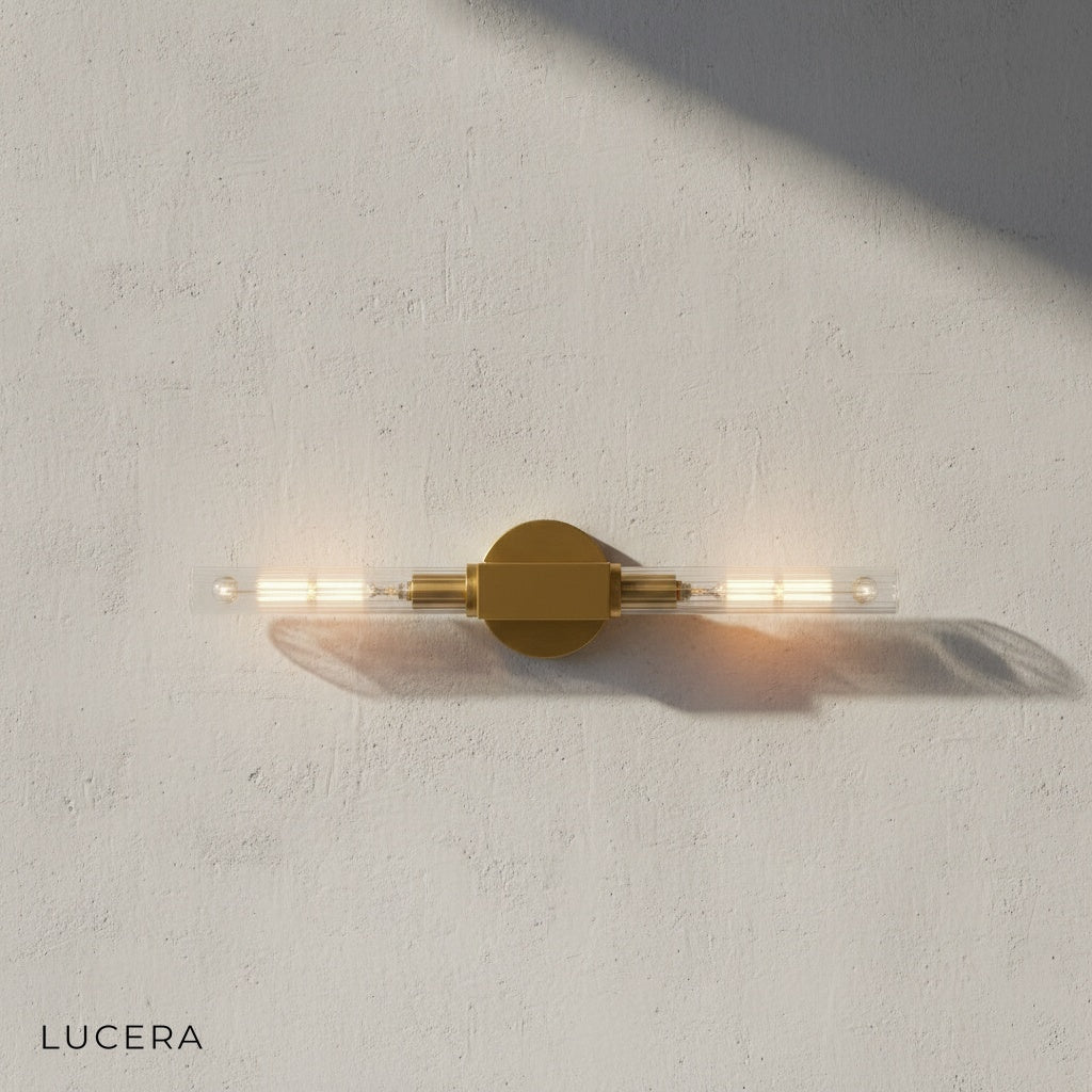 Ravello black wall sconce mounted in bathroom near mirror with warm light