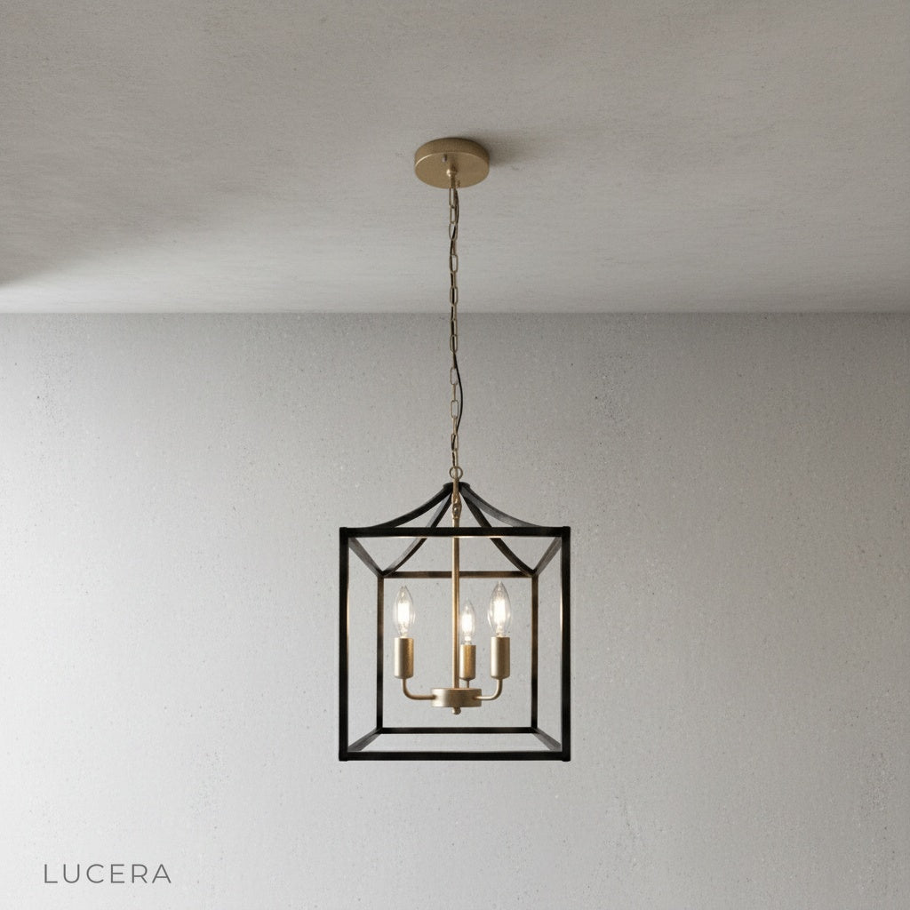 close-up of candle-style bulbs and matte black iron frame on Sacristan pendant