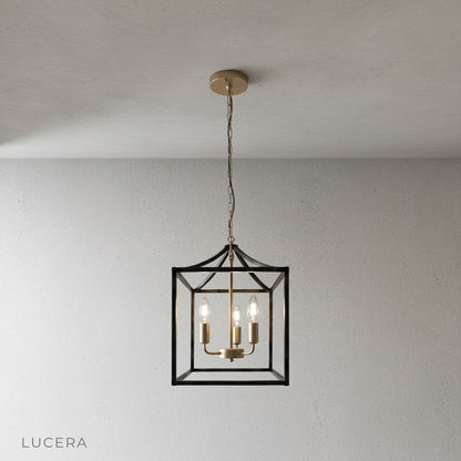 close-up of candle-style bulbs and matte black iron frame on Sacristan pendant