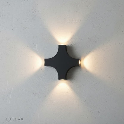 close-up of gold wall lamp detailing waterproof metal shade and arm