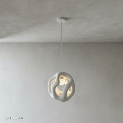 close-up detail of flame pendant light textured glass surface with warm LED glow