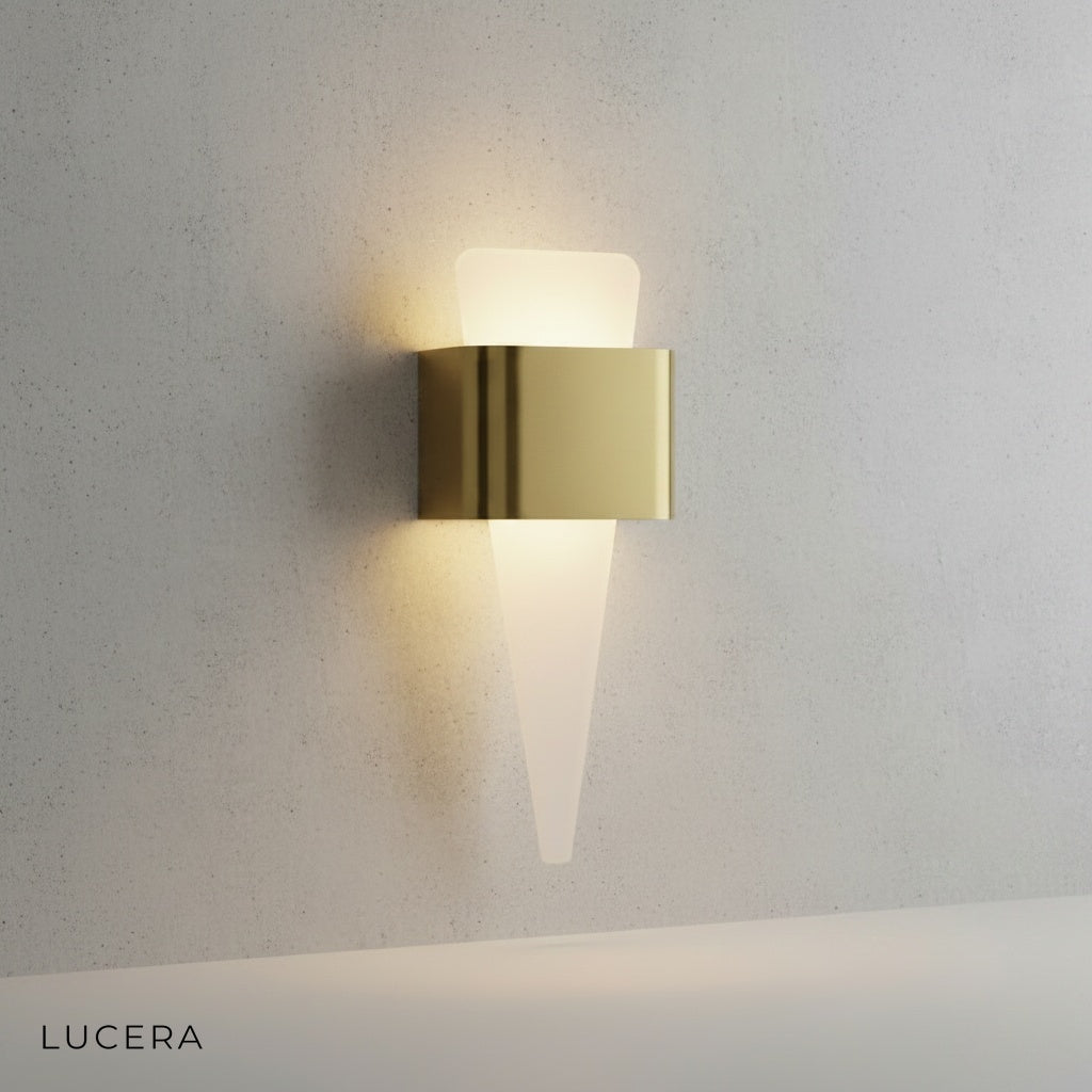 Passo Shark Tooth sconce mounted on dark wood paneling casting a soft ambient glow