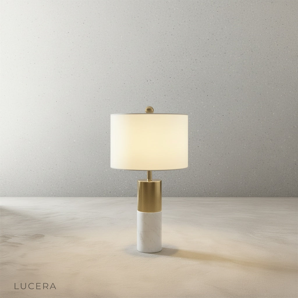 Close-up detail of Essere Table Lamp marble base and sleek metal stem against neutral backdrop